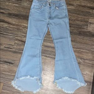 Fashionable Ripped bell bottom jeans